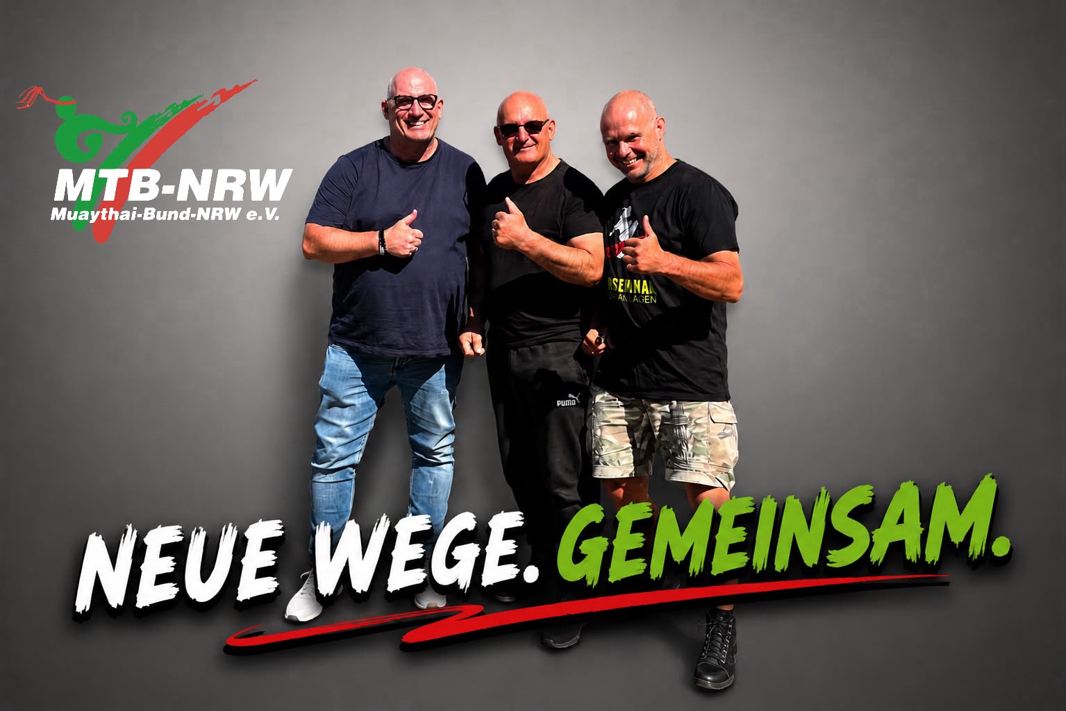 Joe Meiklem, Jürgen Lebbing und René Müller gemeinsam vor grauem Hintergrund mit dem Schriftzug „Neue Wege. Gemeinsam.“ und dem Logo des MTB-NRW.